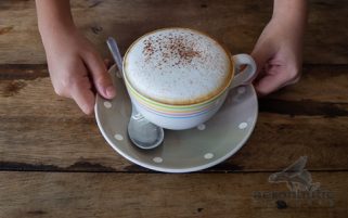 Coffee Stock Photo - Child's Hands Holding Cup of Cappuccino