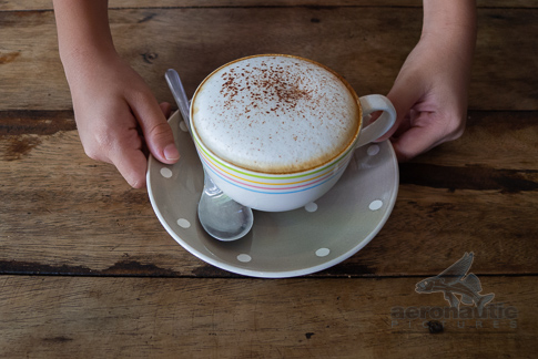 Coffee Stock Photo - Child's Hands Holding Cup of Cappuccino