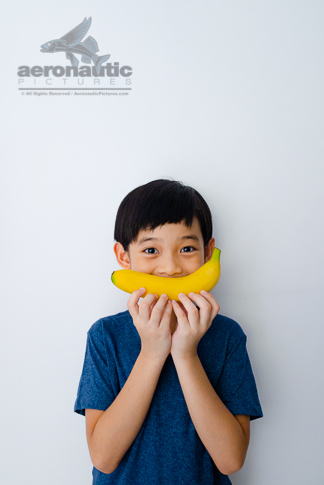 Food Stock Photo - A Kid and a Banana Smile Download Royalty Free
