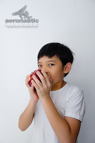 Food Stock Photo - A Kid Eating an Apple Royalty Free Download