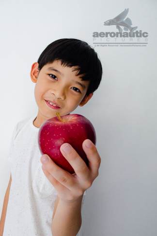 Apple Stock Photo - A Kid Holding a Red Delicious Apple
