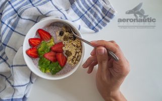 Food Stock Photo - A Hand Scooping Chia Pudding Download Royalty Free