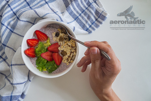 Food Stock Photo - A Hand Scooping Chia Pudding Download Royalty Free